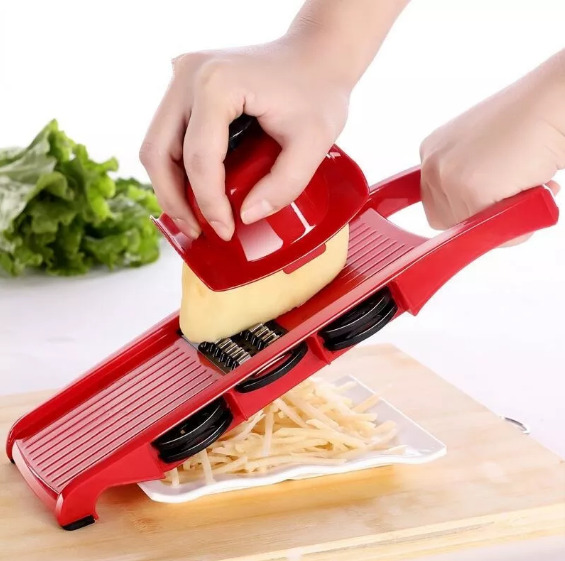 Upgrade your kitchen prep with the 10-in-1 Mandoline Slicer Vegetable Cutter, designed to handle all your chopping needs in one compact tool. Equipped with sharp stainless-steel blades, this manual cutter lets you slice potatoes, grate cheese, julienne carrots, dice vegetables, and peel fruits with ease. The ergonomic design ensures comfortable handling, while the sturdy build delivers long-lasting performance. Its eye-catching pink color adds a modern touch to your kitchen, and the boxed packing makes it ideal for gifting or safe storage. Save time, reduce mess, and enjoy perfectly cut ingredients every time..PNG