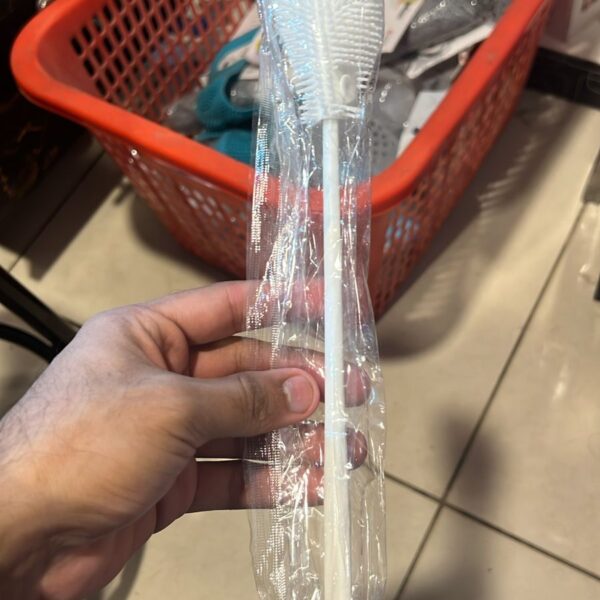 The Silicone Long Handle Cleaning Brush is the perfect solution for cleaning hard-to-reach areas inside mugs, bottles, cups, and other deep containers. Made from soft yet durable silicone bristles, it effectively removes residue without scratching delicate surfaces. Its long ergonomic handle provides a comfortable grip and allows easy access to the bottom of deep mugs and bottles. The flexible silicone bristles bend easily, making cleaning faster, safer, and more hygienic compared to traditional sponge brushes. Easy to rinse and quick-dry, this brush is a must-have for every kitchen. Key Features 🧽 Soft Silicone Bristles – Gentle on glass, ceramic, and stainless steel surfaces🥛 Long Handle Design – Easily reaches deep mugs, bottles, and narrow containers🔄 Flexible & Durable – Bends to clean corners and curves effectively🧼 Hygienic & Easy to Clean – Quick-dry and odor-resistant silicone material✋ Comfortable Grip – Easy handling for effortless daily use🏡 Multi-Purpose Use – Ideal for mugs, water bottles, cups, jars, and tumblersMade in China.PNG